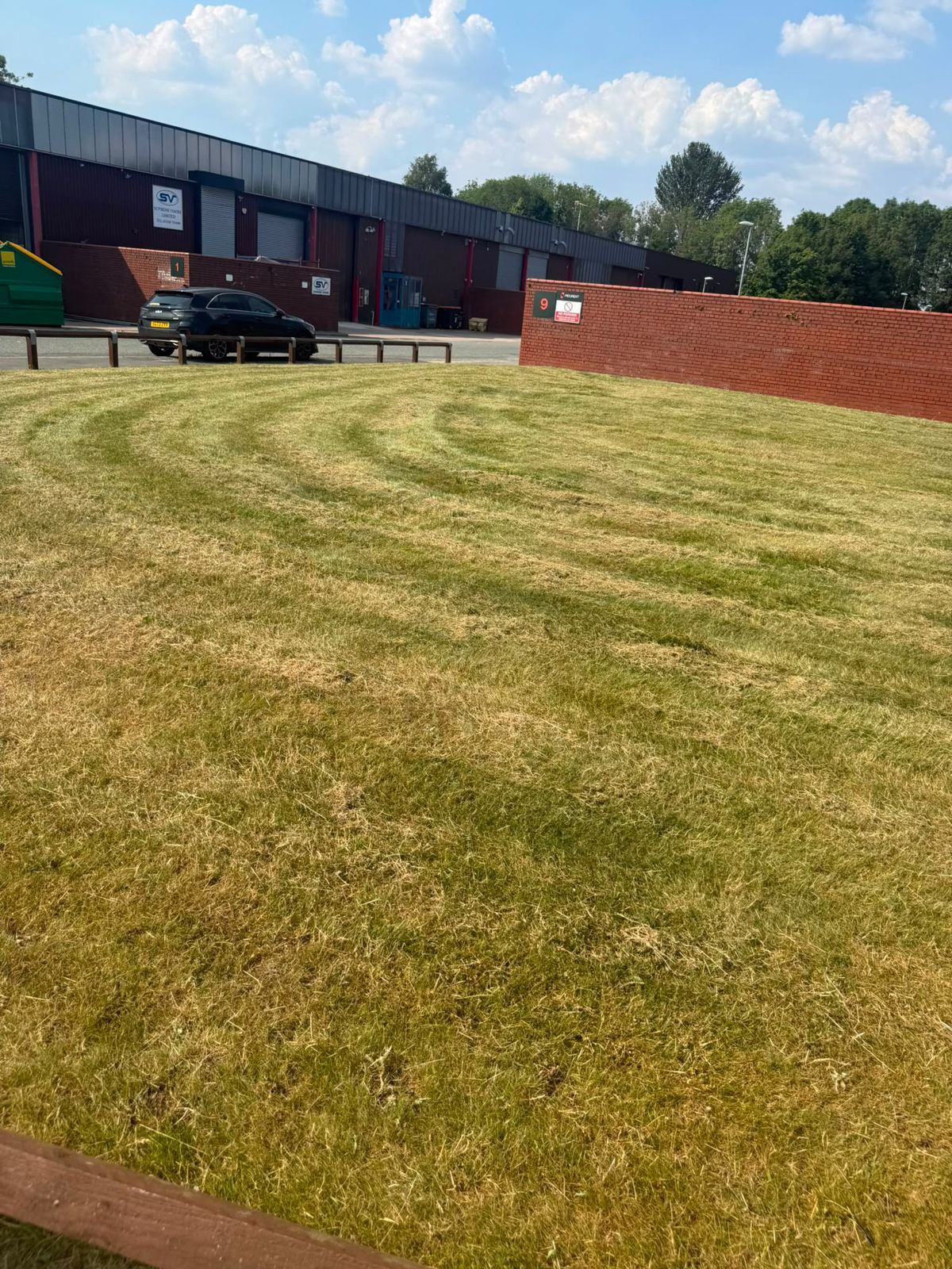 Freshly striped lawn on an industrial estate